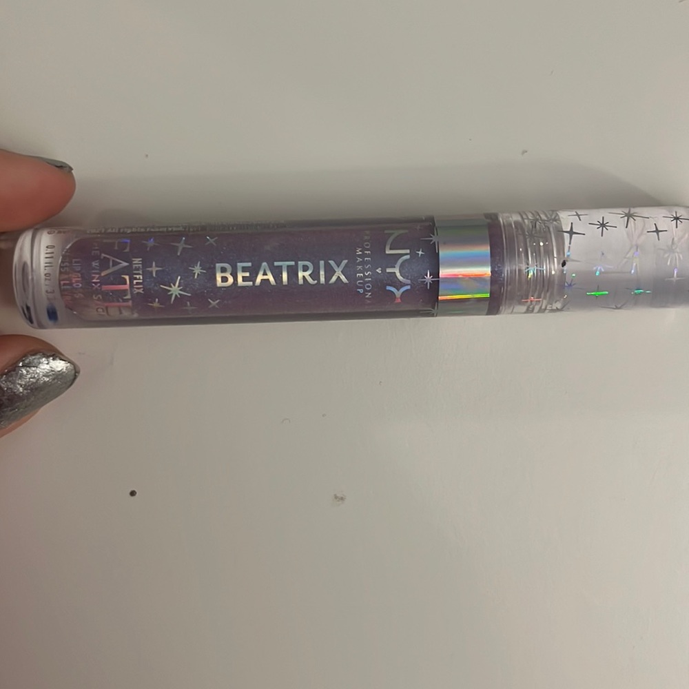 Open but only sampled shimmery lipgloss!